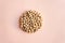 round shaped chickpeas on light pink background