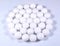 A round shaped pile of white naphthalene balls.