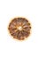 Round slice of dried orange on a white background, isolate. Christmas ornament, the smell of the new year. Added to beverages and
