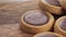 Round small shortbread cookies with chocolate filling on a wooden rustic table.