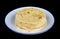 Round soft corn  mini  tortillas  pancakes  on plate isolated black macro