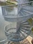 Round steel outdoor staircase to a river