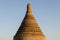 Round, stone stupa of a pagoda in the golden evening light
