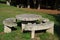 Round stone table with seats