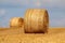 Round straw bales in a field