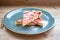 Round strawberry pie with fresh strawberries slice on plate dish on wooden table background