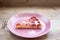 Round strawberry pie with fresh strawberries slice on plate dish on wooden table background