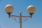 Round street lamp on blue sky background