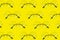 Round sunglasses pattern on yellow background. Minimal summer pattern. Flat lay