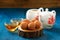 Round sweets in cocoa powder on oak board with tea and teapot