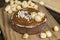 round tartlet with salted caramel and roasted hazelnuts