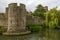 Round tower and willow tree on moat at Bishop palace ,Wells