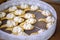 Round tray with biscuit spoons and whipped cream dessert, wedding candy bar