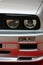 Round twin front headlights of first generation of high performance compact coupe BMW E30 M3