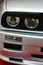 Round twin front headlights of first generation of high performance compact coupe BMW E30 M3