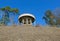 Round unfinished rotunda on top of a hill