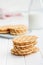 Round waffle biscuits on white table