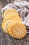 Round waffle biscuits on wooden table