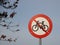 Round Warning Sign with No Biking Allowed