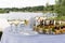 Round white table with glasses of champagne and mirror dish with canapes in nature