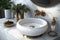 round white wash basin with brass faucet and accessories