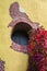 Round window - a loophole in a brick wall of the Tower Ruin in the Catherine Park and the curling garden ivy in bright autumn