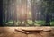 Round wood board on wooden table on forest background