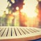 Round wood table top on blur bokeh background of sunlight