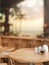 A round wooden table in a cozy luxury beachfront hotel lounge or restaurant