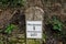 Roundtop milestone marker along the Thames and Severn Canal showing Walbridge 2 miles Inglesham 26 3/4, Stroud