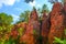 Roussillon ochre deposit: Beautiful pines in orange canyon