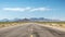 Route 66 highway road at midday clear sky desert mountains background landscape