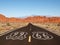 Route 66 Pavement Sign with Red Rock Mountains