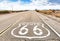 Route 66 road sign with blue sky background. Classic concept for travel and adventure in a vintage way