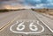 Route 66 road sign with blue sky background. Classic concept for travel and adventure in a vintage way