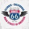 Route 66 typography graphic for t-shirt. Original clothes design with grunge, wings and slogan. Vector illustration.