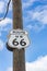 Route US 66 highway sign on power pole Route 66 USA.  one of the incredible variety of 66 signs seen along the historic route