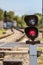 Routing traffic light with a red signal on railway