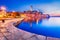 Rovinj - Istria Peninsula, Croatia. Twilight with old town harbor water reflection