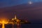 Rovinj old town at night with moon on the colorful sky, Adriatic sea coast of Croatia, Europe