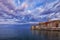 Rovinj town with multicolored buildings and yachts moored along embankment, Croatia.