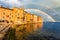 Rovinj town with multicolored buildings and yachts moored along embankment, Croatia.