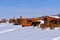 Row of Allis Chalmers tractors in snowdrifts