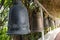 Row of Ancient bells at a buddhist temple in Thailand.