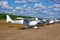 Row of assorted single-engine piston-powered ultralight airplanes displaed on Karhula aviation museum airshow. Kotka, Finland