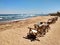 Row of bamboo chaise lounge on beach in Dahab, Sinai, Egypt. Beautiful seascape. Relax time.