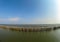 Row of Bamboo shore coastal protection in a bay of Samut Prakan Province, Thailand.