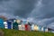 Row of beach huts with a deep blue sky, colourful beach huts