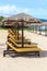 Row of beach parasols and chairs