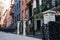 Row of Beautiful Homes and Residential Buildings along a Sidewalk in Chelsea of New York City
